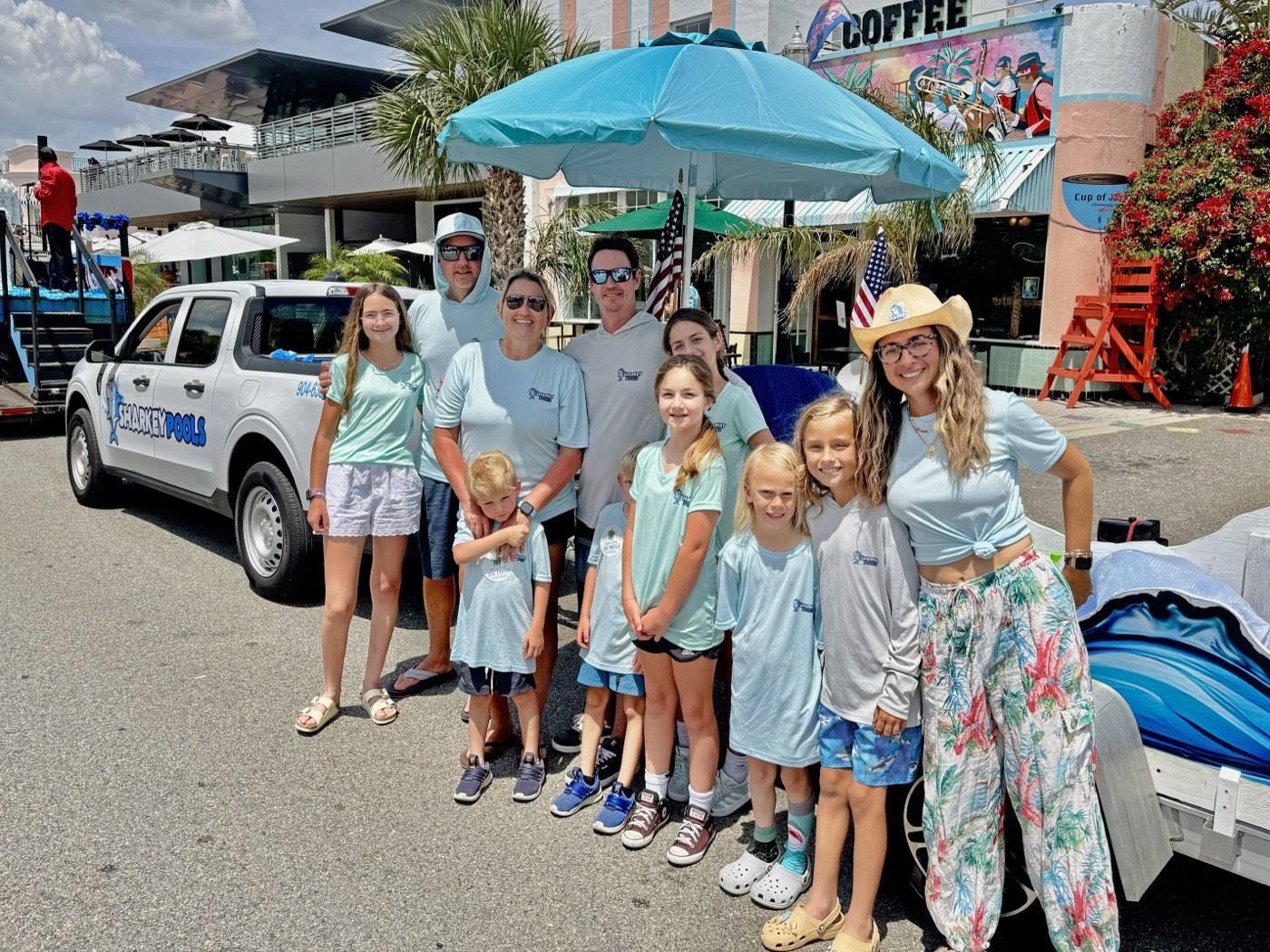 The Sharkey Pools family and crew with the Sharkey truck at the Jacksonville Beach Opening of the Beaches parade